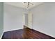 Bright bedroom featuring modern lighting and dark wood floors, creating a clean and inviting space at 386 White Oak Ln, Greenwood, IN 46142
