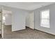 Spacious bedroom features carpet, windows, a closet, and neutral walls at 386 White Oak Ln, Greenwood, IN 46142
