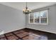 Dining room with hardwood floors, chandelier, and window at 386 White Oak Ln, Greenwood, IN 46142