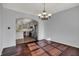 Dining room with chandelier and views into the kitchen at 386 White Oak Ln, Greenwood, IN 46142