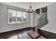 The dining room has hardwood floors, natural lighting, and an elegant chandelier at 386 White Oak Ln, Greenwood, IN 46142