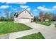 Charming two-story brick home with well-manicured lawn and two-car garage at 386 White Oak Ln, Greenwood, IN 46142