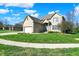 Charming two-story brick home with well-manicured lawn and two-car garage at 386 White Oak Ln, Greenwood, IN 46142