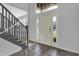 Bright foyer with tile flooring, staircase, and a front door with sidelights at 386 White Oak Ln, Greenwood, IN 46142