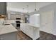 Spacious kitchen with gray cabinets, white countertops and island featuring stainless steel appliances at 386 White Oak Ln, Greenwood, IN 46142
