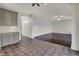 An eat-in kitchen transitions to a large seating area with dark wood floors at 386 White Oak Ln, Greenwood, IN 46142