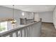 Open loft area with soft carpeting, offering a bright and flexible space for various activities at 386 White Oak Ln, Greenwood, IN 46142