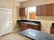 Updated kitchen with wood cabinets and tile countertops at 416 N Grant Ave, Indianapolis, IN 46201