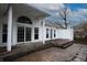 Back deck with sliding glass doors and a patio area of a home surrounded by foliage at 4232 Bunting Ln, Columbus, IN 47203