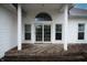 Covered back patio of home with sliding glass doors and view of backyard at 4232 Bunting Ln, Columbus, IN 47203