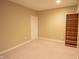 Clean, carpeted basement room with recessed lighting and natural paint at 4232 Bunting Ln, Columbus, IN 47203