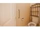 Bathroom featuring a toilet and shelving unit next to the door at 4232 Bunting Ln, Columbus, IN 47203