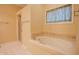 Bathroom features a soaking tub with tile surround and a separate shower stall at 4232 Bunting Ln, Columbus, IN 47203