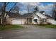 Beautiful single-Gathering home featuring a brick exterior, attached garage and well-manicured lawn and landscaping at 4232 Bunting Ln, Columbus, IN 47203