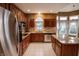Spacious kitchen featuring stainless steel appliances, granite countertops, and a central island at 4232 Bunting Ln, Columbus, IN 47203