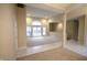 Bright, open living room with large windows, neutral carpet, and pillar accents for an elegant feel at 4232 Bunting Ln, Columbus, IN 47203