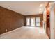 A bright living room with built-in shelving, a fireplace and patio doors at 4232 Bunting Ln, Columbus, IN 47203