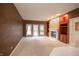 Bright living room with fireplace, built-in shelving, and french doors leading to a backyard at 4232 Bunting Ln, Columbus, IN 47203