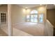 Inviting living area featuring neutral walls, plush carpeting, and large windows providing ample natural light at 4232 Bunting Ln, Columbus, IN 47203