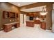 Open floor plan with desk, kitchen, and living area with stainless steel appliances at 4232 Bunting Ln, Columbus, IN 47203