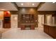 Open living space with built-in shelving, a fireplace, and access to multiple rooms at 4232 Bunting Ln, Columbus, IN 47203