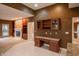 Open concept living space with built-in shelving, a fireplace, and a desk with storage at 4232 Bunting Ln, Columbus, IN 47203