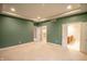 Main bedroom features neutral carpet, recessed lighting, and access to ensuite at 4232 Bunting Ln, Columbus, IN 47203