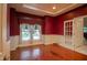 Spacious room with hardwood floors, trim, and abundant natural light at 4232 Bunting Ln, Columbus, IN 47203