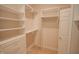 Walk-in closet features custom shelving, ample storage, and great lighting at 4232 Bunting Ln, Columbus, IN 47203