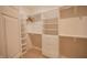 Walk-in closet features custom shelving, ample storage, and great lighting at 4232 Bunting Ln, Columbus, IN 47203