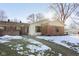 Brick ranch home with partial snow cover at 4314 London Ct, Anderson, IN 46013