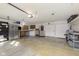 Spacious two-car garage with extra storage shelving and workbench at 4314 London Ct, Anderson, IN 46013