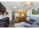 Open living space with a view into the kitchen and breakfast bar at 4314 London Ct, Anderson, IN 46013