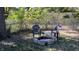 Small backyard with fire pit and seating area at 4712 Caroline Ave, Indianapolis, IN 46205