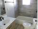 Bathroom with gray tile, marble vanity, and new fixtures at 4712 Caroline Ave, Indianapolis, IN 46205