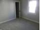 Simple bedroom with carpet flooring and neutral walls at 4712 Caroline Ave, Indianapolis, IN 46205