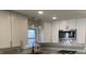 Modern kitchen with white cabinets and granite countertops at 4712 Caroline Ave, Indianapolis, IN 46205