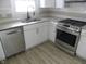 Modern kitchen with stainless steel appliances and granite counters at 4712 Caroline Ave, Indianapolis, IN 46205