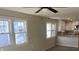 Bright living room with hardwood floors and ceiling fan at 4712 Caroline Ave, Indianapolis, IN 46205