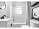 Bathroom with new tile in the shower and updated vanity at 4926 Crittenden Ave, Indianapolis, IN 46205
