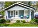 Charming bungalow-style home with inviting porch and manicured front yard at 4926 Crittenden Ave, Indianapolis, IN 46205