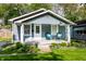 Quaint home with welcoming front porch and cozy seating area at 4926 Crittenden Ave, Indianapolis, IN 46205