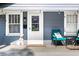Cozy front porch with seating and decorative 