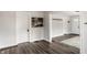 Hallway featuring wood floors and white trim at 4926 Crittenden Ave, Indianapolis, IN 46205