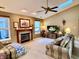 Living room with vaulted ceiling, fireplace, and large screen TV at 545 Lake Crossing Ln, Franklin, IN 46131