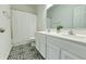 Bathroom with double vanity, shower/tub combo, and patterned tile floor at 5705 W 900 N, McCordsville, IN 46055