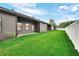 Spacious backyard with green grass and privacy fence at 5870 Harbour Town Dr, Noblesville, IN 46062