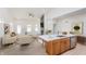Open concept kitchen and living area with hardwood floors and island at 5870 Harbour Town Dr, Noblesville, IN 46062