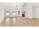 Spacious living room with hardwood floors and marble fireplace at 5870 Harbour Town Dr, Noblesville, IN 46062