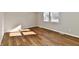 Bright bedroom with new wood floors and neutral walls at 6240 W Mills Rd, Indianapolis, IN 46221